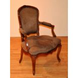 A late Victorian French style open armchair, upholstered in later fawn velour,