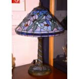 A Tiffany style table lamp with shade, converted to electricity,
