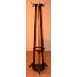 A tall oak hat and coat stand, with stick stand recess,