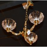 A brass three branch electrolier, with three heavy glass fluted shades,