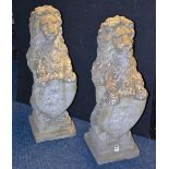 A pair of garden stoneware lion figures,