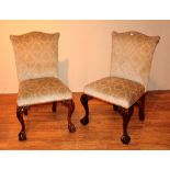 A set of four Chippendale style dining chairs, upholstered in cream floral fabric,