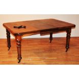 A mahogany telescope extending dining table, circa early 20th century, raised on turned supports,