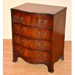 A mahogany serpentine chest of drawers in the George III style, with four graduated drawers,