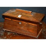 A Victorian rosewood sarcophagus shaped tea caddy, with integral lead lined compartments,