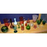 A quantity of coloured glass, circa 19th/20th century, to include cranberry glass jugs,