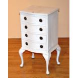 A white painted serpentine chest of drawers, of small form, with four drawers,