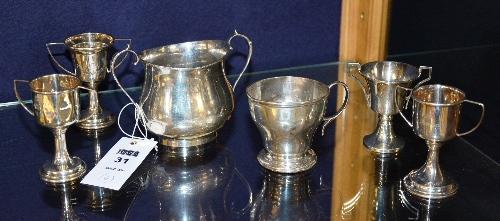 Four small silver prize cups circa 1950's, hallmarks for Birmingham, engraved to three examples,