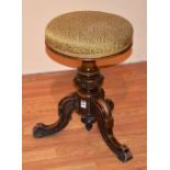 A Victorian mahogany piano stool, with revolving circular top,