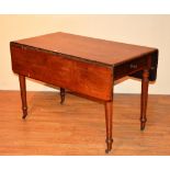 A Victorian mahogany pembroke table, with end drawer, drop flaps, raised on turned spindle supports,