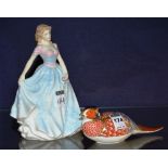 A Royal Crown Derby bird paperweight, button to base, 19cm long,