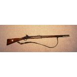 An Enfield percussion rifle, circa late 19th century, the two band rifle marked tower 1868,