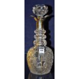 A crystal decanter with silver collar, hallmarks for Sheffield, with mushroom shaped stopper,