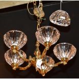 A brass five branch electrolier, with five heavy glass fluted shades,