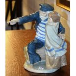 A large Nao by Lladro figure group, in the form of a sailor and child,