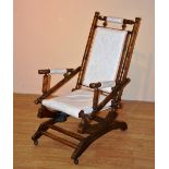 An American spring rocker mahogany armchair, circa early 20th century,