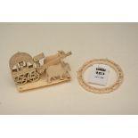 An Indian ivory figure group in the form of cattle pulling carriage, 9cm high,