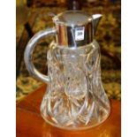 A crystal water jug, decorated with plated lid and handle,