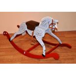 A painted child's rocking horse,