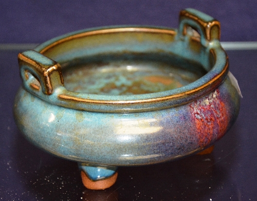 A Chinese glazed terracotta bowl, glazed in blue with handles,