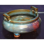 A Chinese glazed terracotta bowl, glazed in blue with handles,