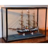 A model ship, in glazed display case,