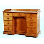 A Victorian birds eye maple washstand, with open gallery above drawer and panelled door,