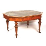 A Victorian oak octagonal library writing table, circa 1845, with leather top,