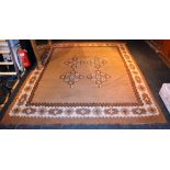 A Kilim carpet, with geometric motifs and border on two tone brown and beige ground,