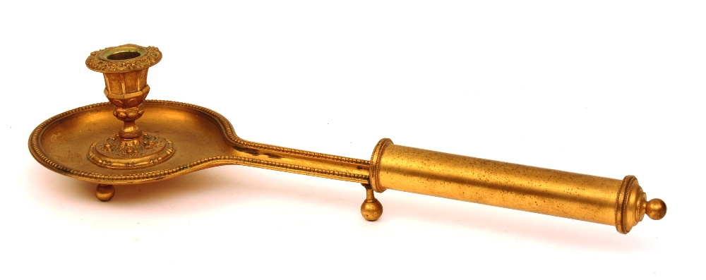 A Louis-Phillippe gilt-bronze chamber stick, circa 1830, with long handle,