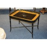 A papier mache tray top occasional table, raised on X-form stretchers, 46cm high x 66.