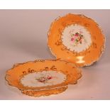 A 19th century porcelain fruit service decorated with floral garlands on a pale orange ground,