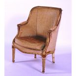 A painted and parcel gilt bergere armchair, circa 1900, in late 18th century style,