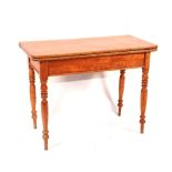 An early Victorian maplewood fold-over table, circa 1840,