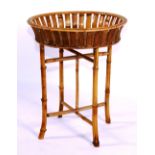A five tier rattan and bamboo shoe stand, circa 1890, 94cm high x 27cm wide x 32cm deep,