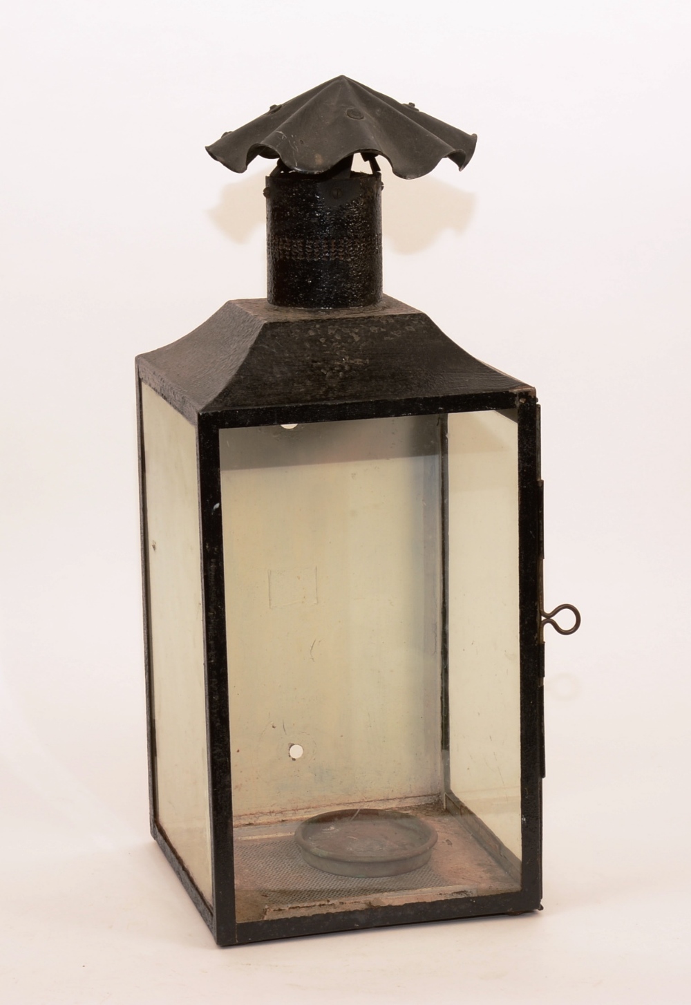 A painted wall lantern circa 1850, with top chimney and side opening with glass panels,