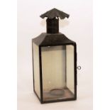 A painted wall lantern circa 1850, with top chimney and side opening with glass panels,