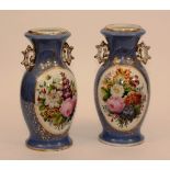 A pair of French porcelain vases with floral panels on an Hyacinth blue ground,