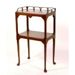 A George II mahogany etagere, circa early 19th century, with pierced gallery above two open tiers,