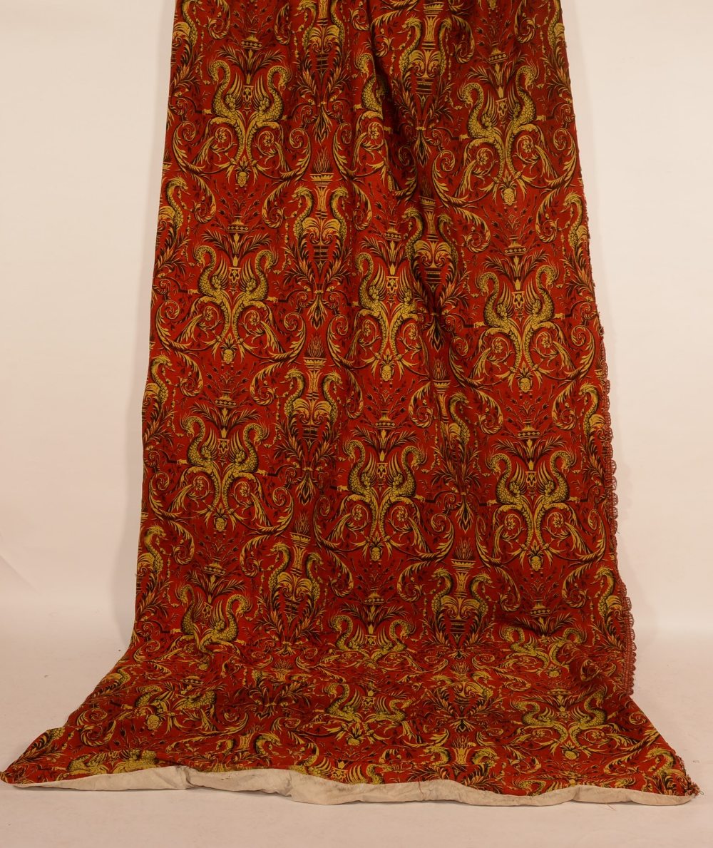 A pair of French woven wool curtains circa 1890, decorated with red/black Neo-Renaissance design,