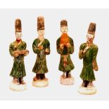 A set of four Chinese Ming pottery immortal figures,