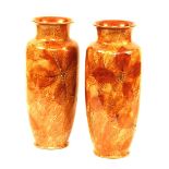 A pair of Royal Doulton glazed pottery vases, with leaf decoration on pale brown ground, MB and no.