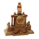 A Gout D'Egypte bronze clock by Lerolle Freres Paris, circa 1825, with figure surmount,