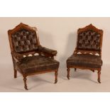 A pair of walnut chairs in the manner of Bruce Talbert, circa 1870, en suite, one with arms,