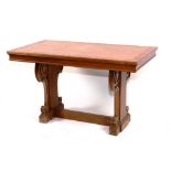 An oak centre table, circa first half of 20th century, with architectural scroll supports,