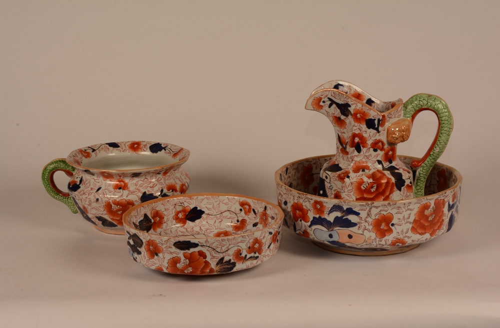 An Ironstone Pottery four piece toilet set, comprising of jug, chamber pot and two graduated bowls,