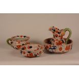 An Ironstone Pottery four piece toilet set, comprising of jug, chamber pot and two graduated bowls,