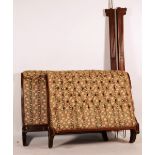 A Regency mahogany sleigh double bed, upholstered in floral fabric,