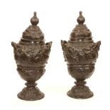 A pair of large bronze vases with covers, circa 19th century, with leaf decoration,