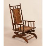 A late Victorian mahogany spring rocker armchair,